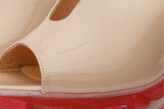 The Caratal Cream Patent Leather Sandal