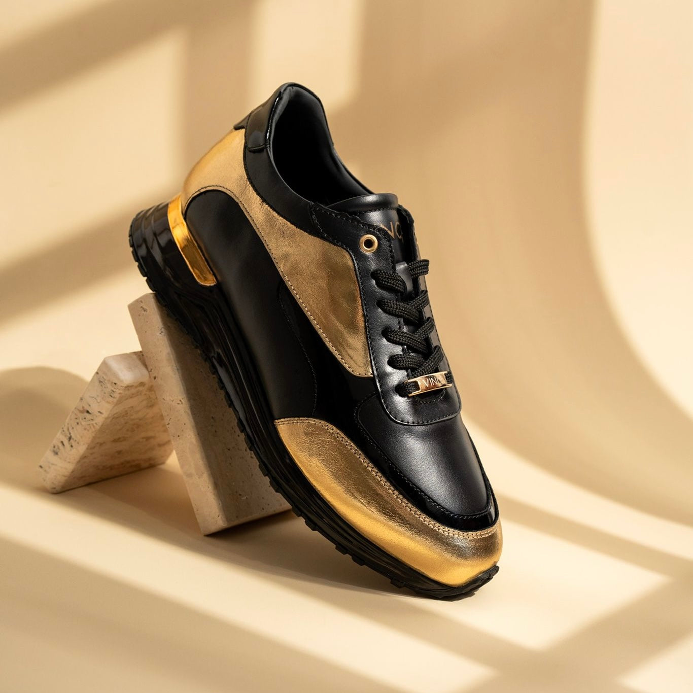 The Arda Black Gold Leather Sneaker