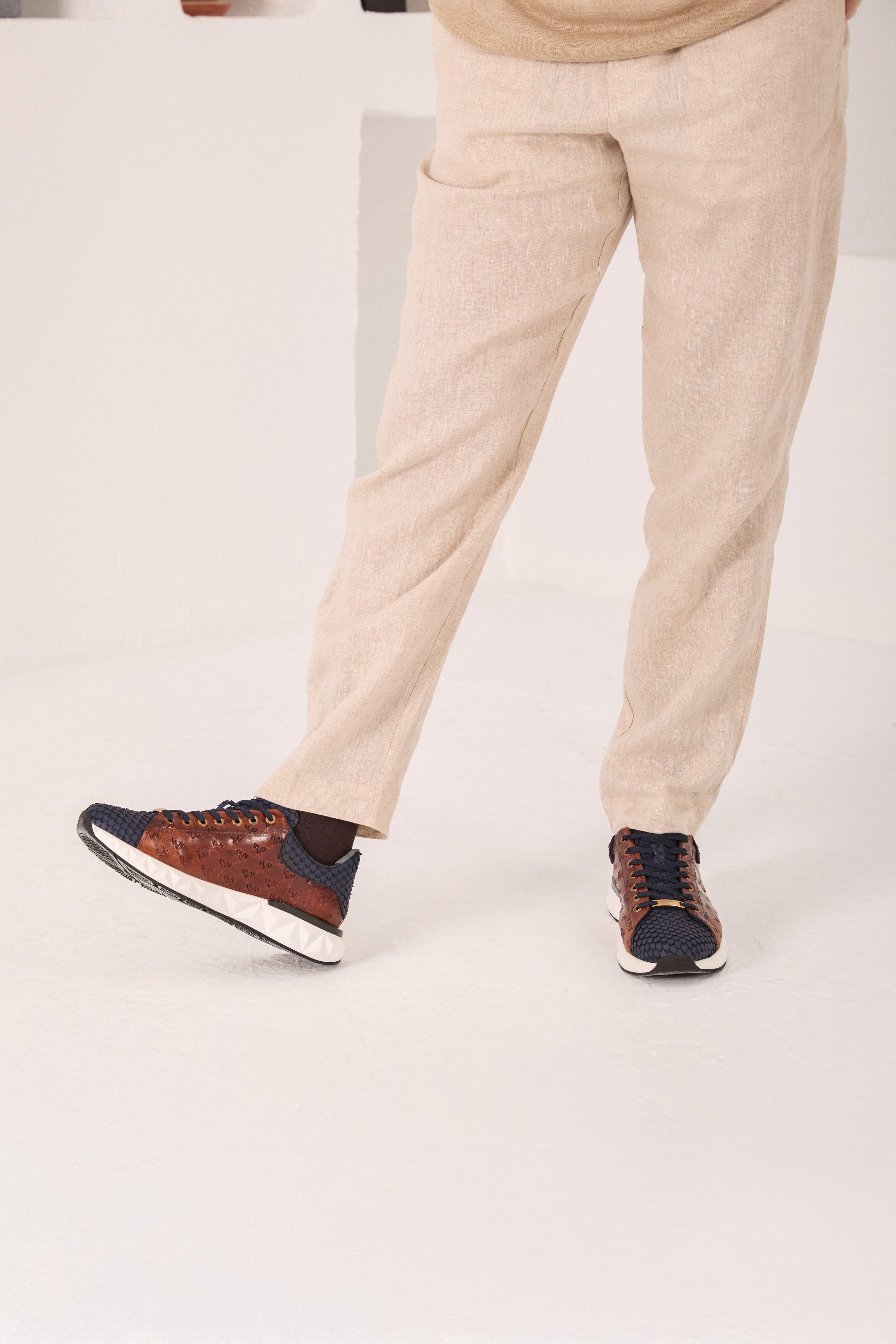 The Caesars Navy Tan Leather Sneaker